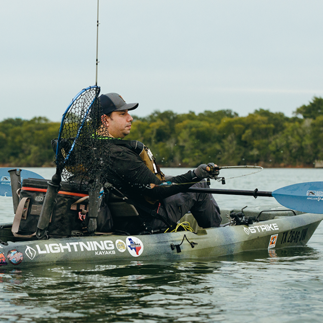 angler drift snap button tidal blue across angler's lap while casting