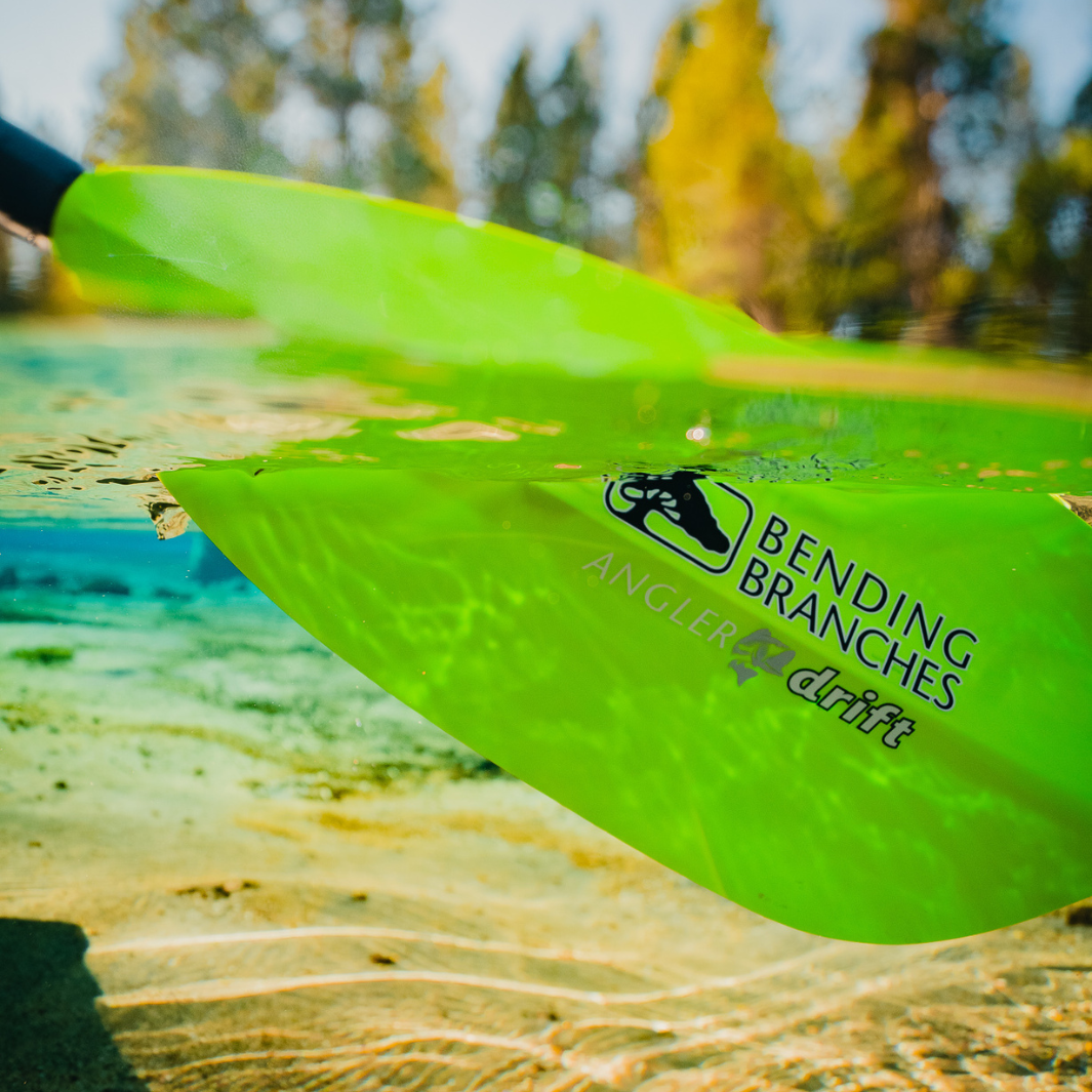 Angler Drift in Electric Green part way underwater (above/below image)